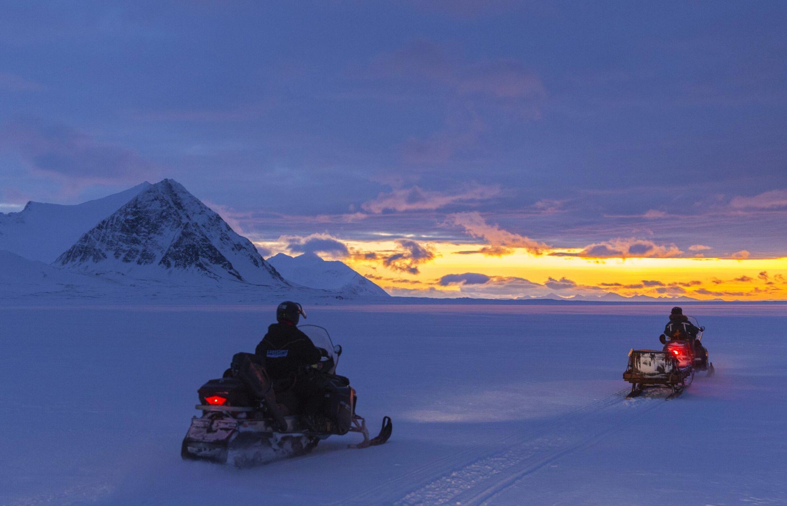 Svalbard basecamp explorer snowmobiling dark season scaled