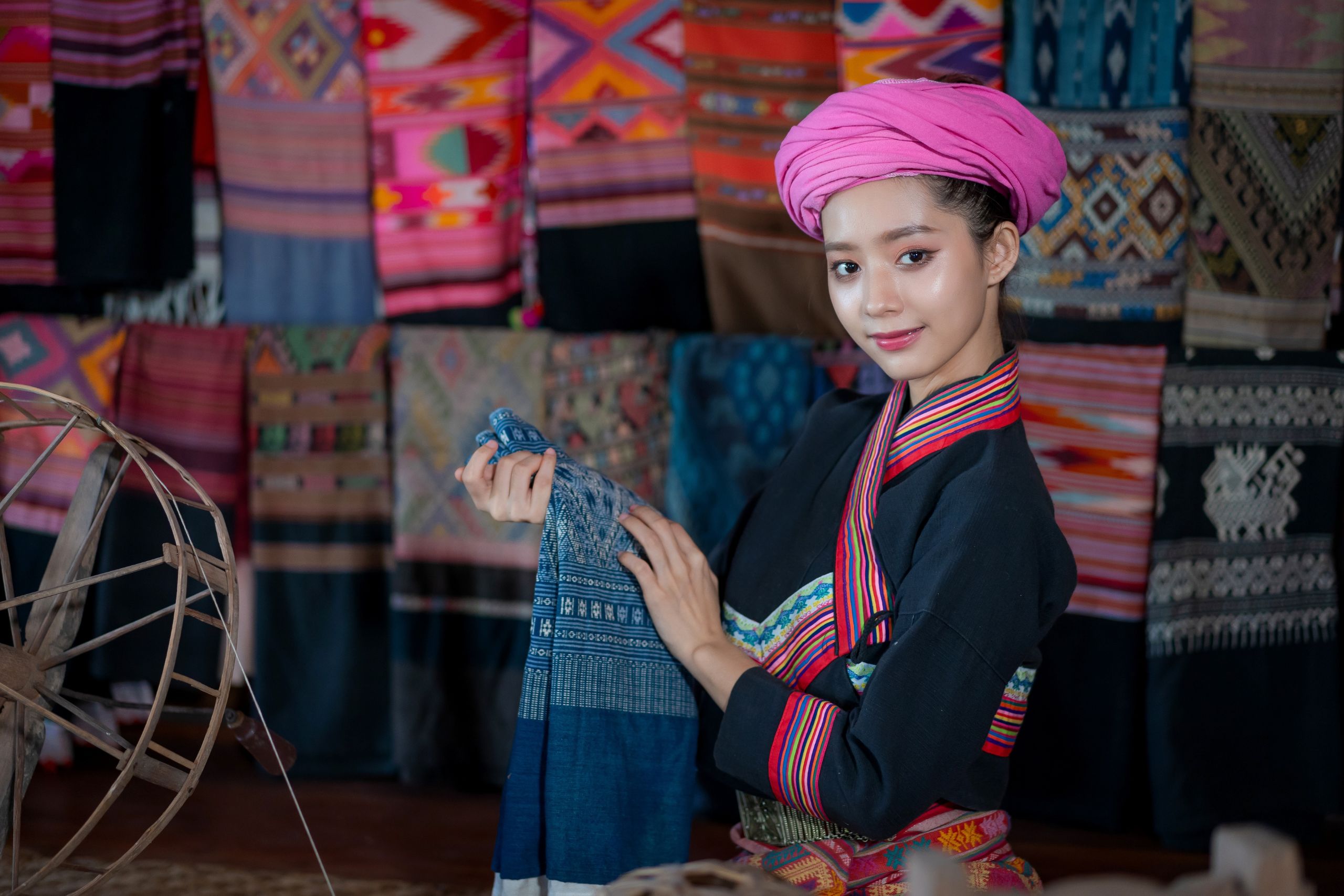 pretty asian tai lue women beautifully wearing local dress traditional fabrics and textiles with unique craftsmanship and famous sarong the old house